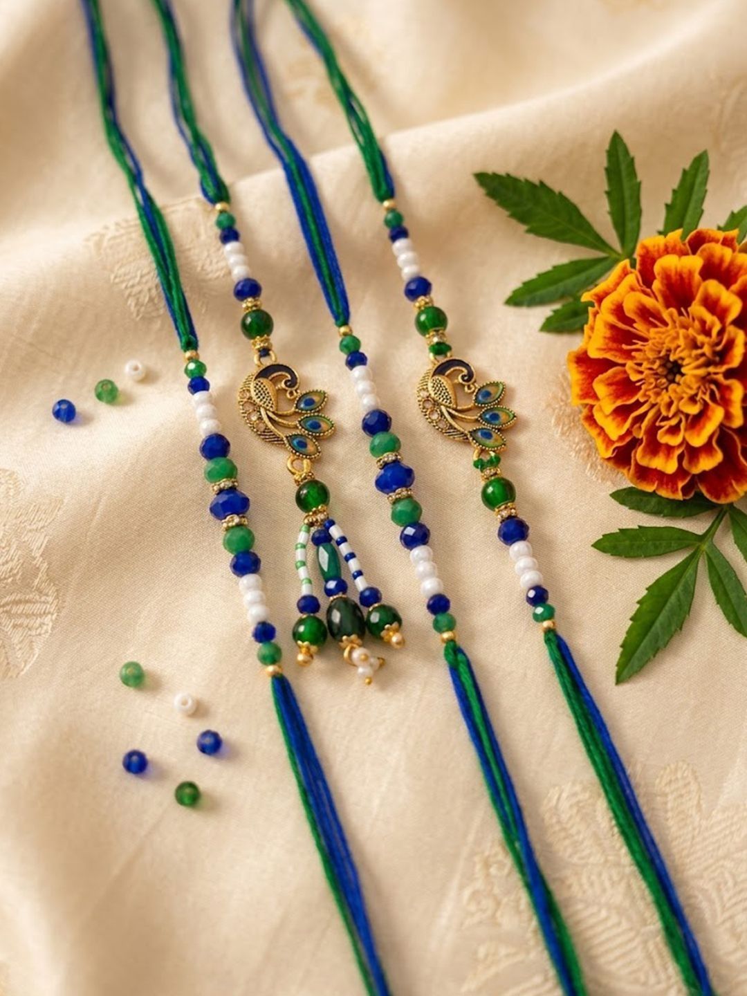 NVR Set Of 4 Green Peacock Design Artificial Beads Thread Rakhi With Roli Chawal