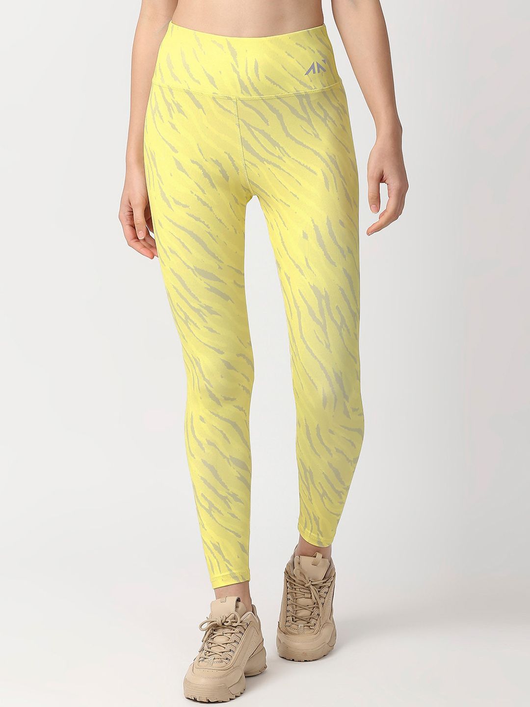 AESTHETIC NATION Women Yellow Printed Dry Fit Tights Price in India