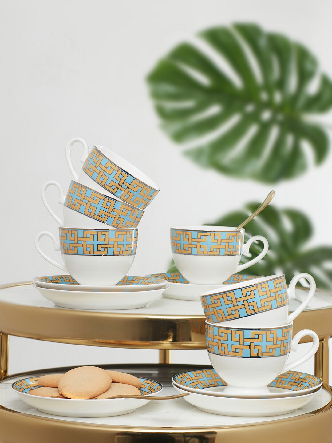 HomeTown 12 Pieces White & Blue Printed Bone China Glossy Cups and Saucers Set Price in India