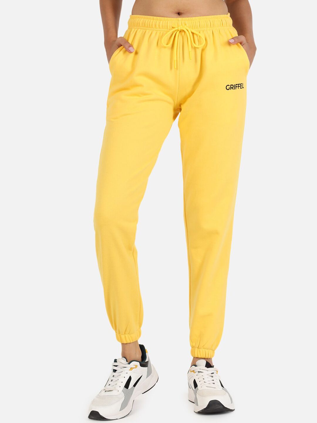 GRIFFEL Women Yellow Solid Cotton Joggers Price in India
