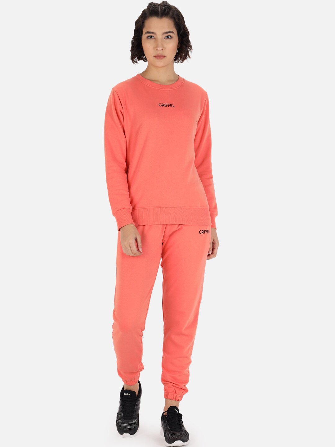 GRIFFEL Women Peach-Colored Solid Tracksuit Price in India