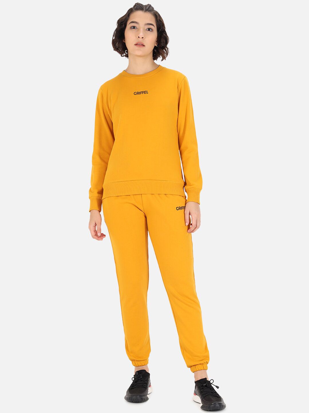 GRIFFEL Women Mustard Yellow Solid Cotton Tracksuits Price in India