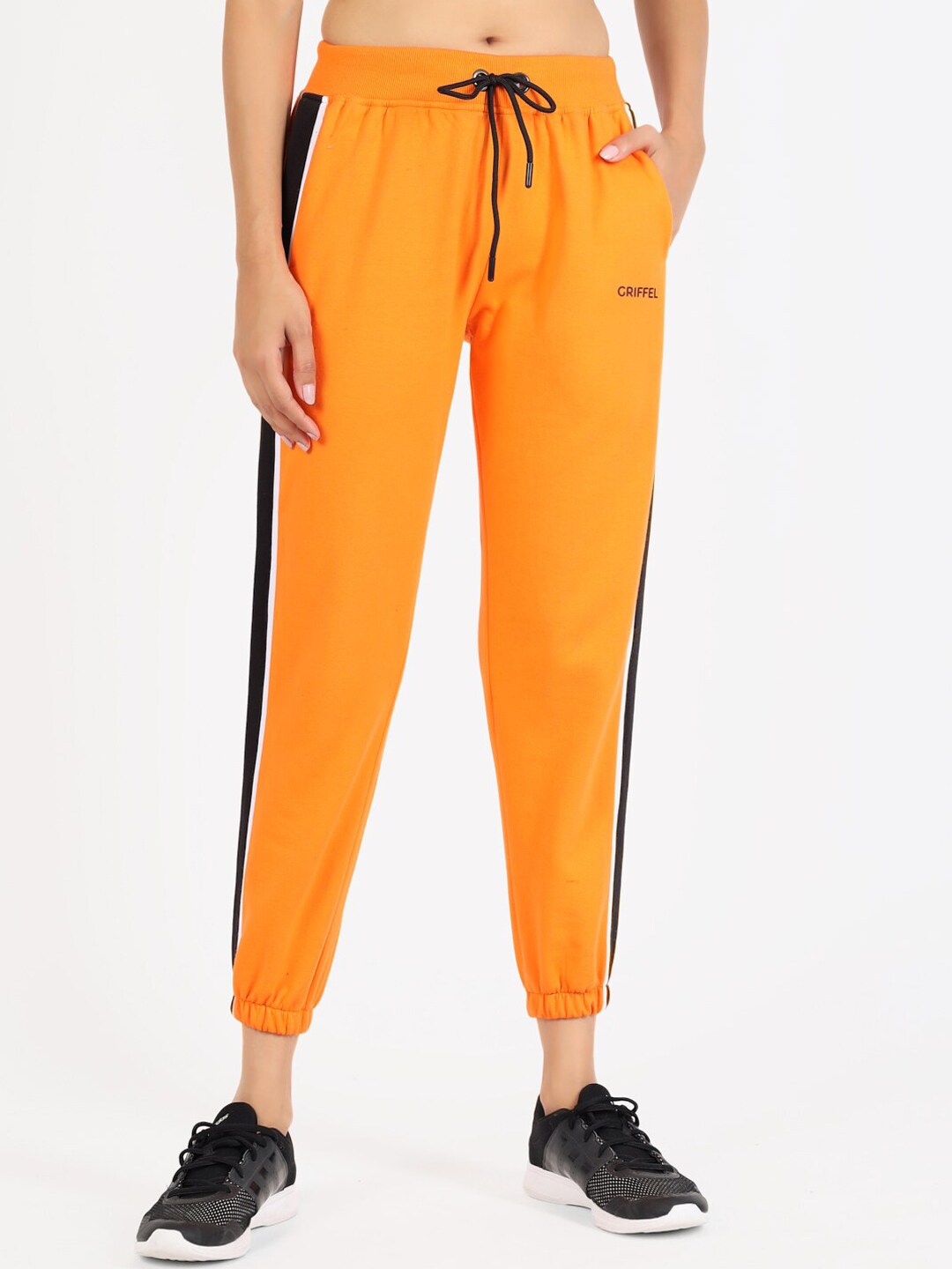 GRIFFEL Women Orange Solid Cotton Joggers Price in India