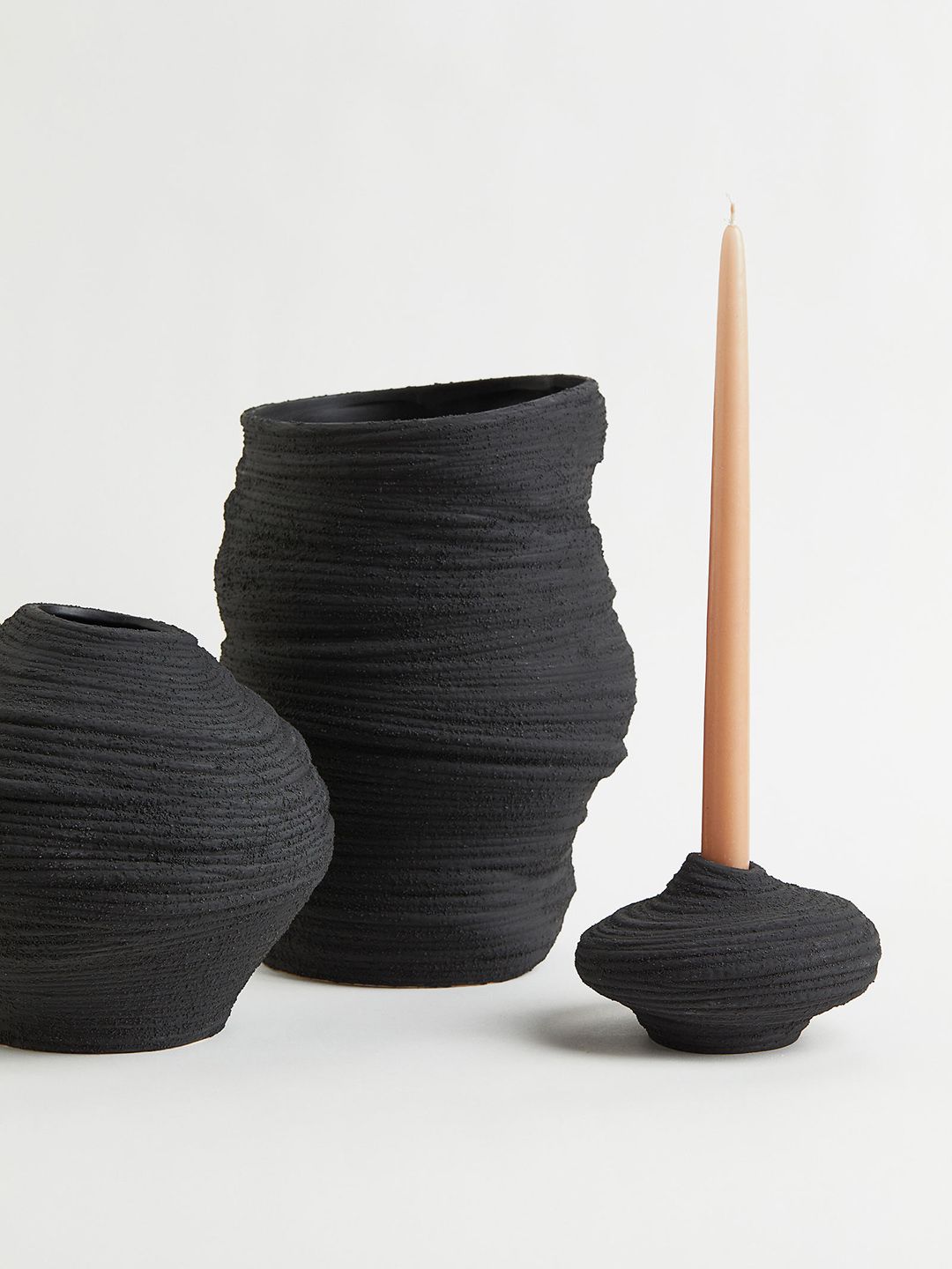 H&M Black Textured Asymmetric Stoneware Candlestick Price in India