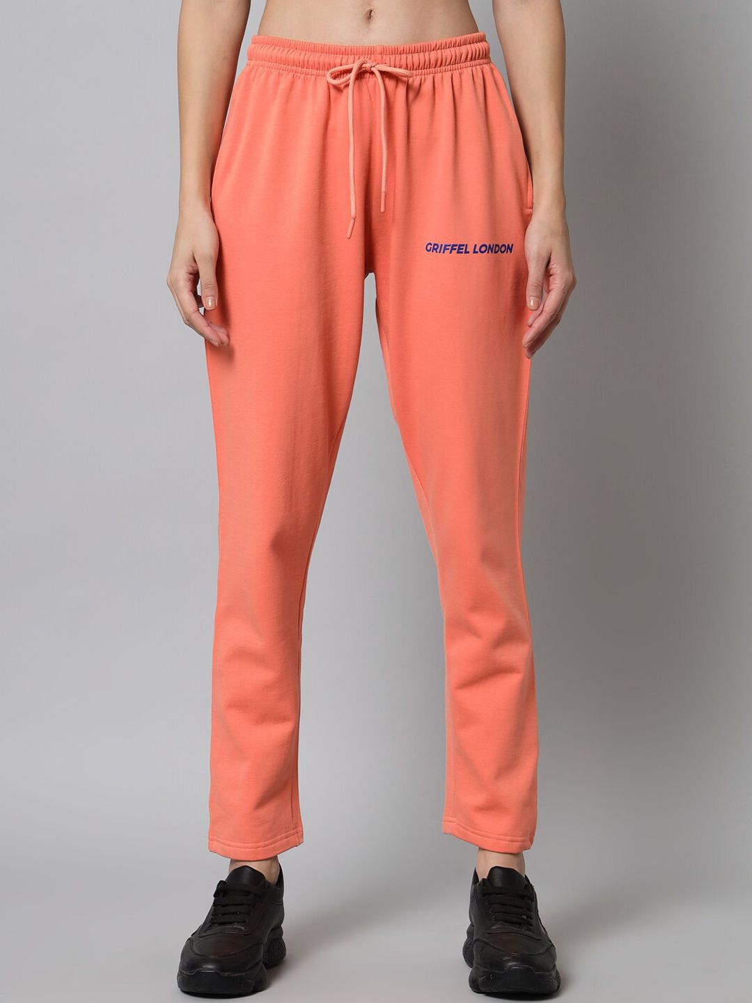 GRIFFEL Women Peach Solid Track Pants Price in India