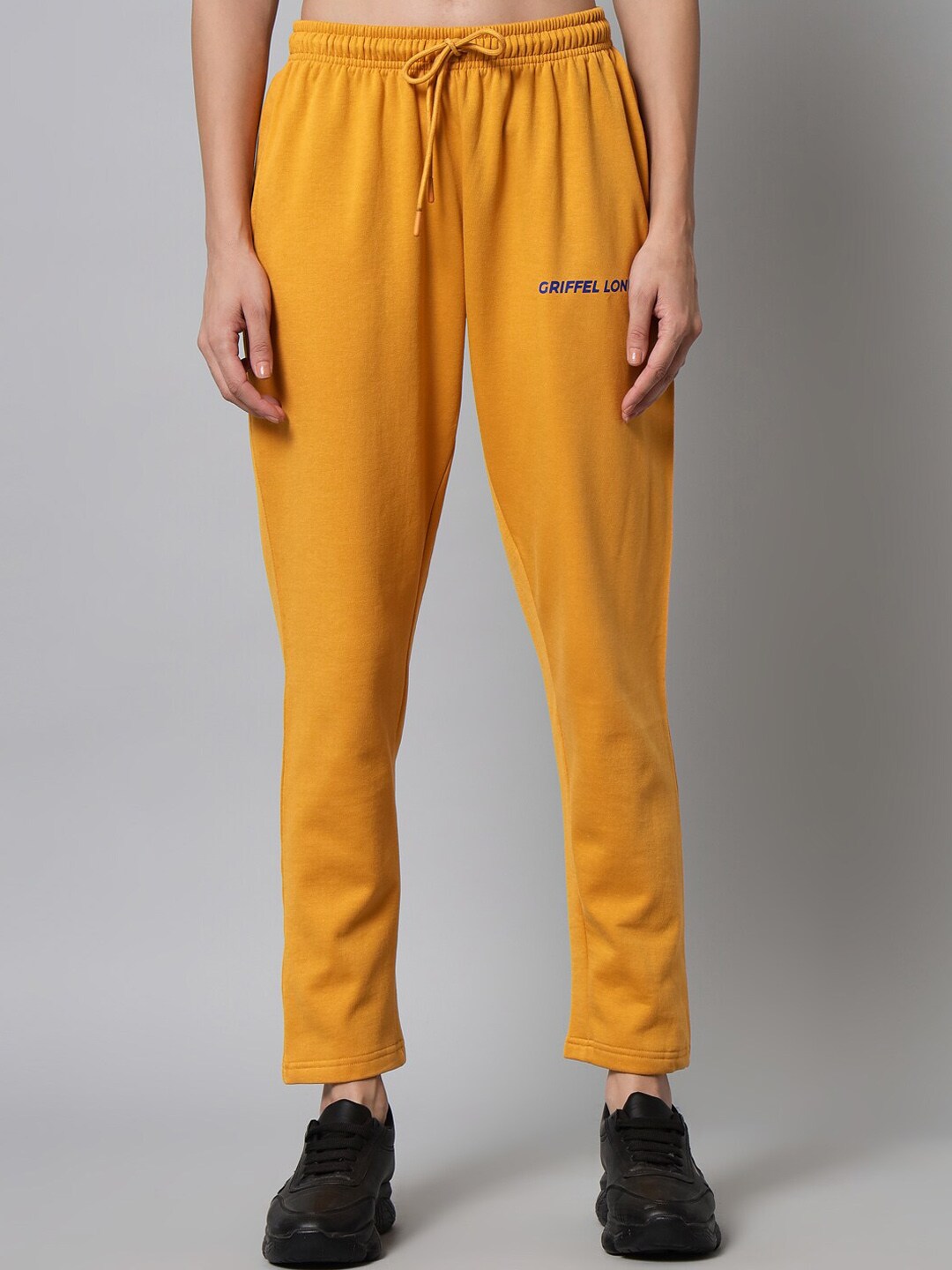 GRIFFEL Women Mustard Solid Cotton Track Pants Price in India