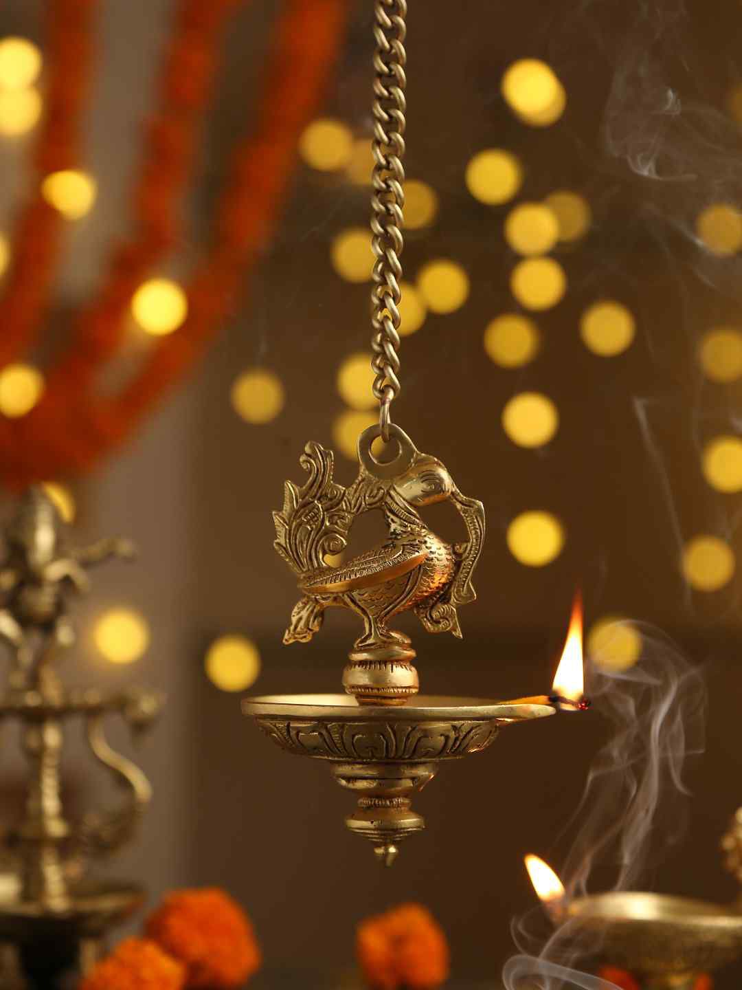 Amoliconcepts Gold-Toned Solid Brass Peacock Hanging Diya With Chain Price in India