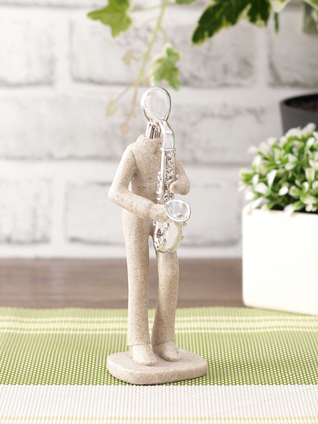 TAYHAA Cream & White Textured Stone Finish Musician Showpieces Price in India