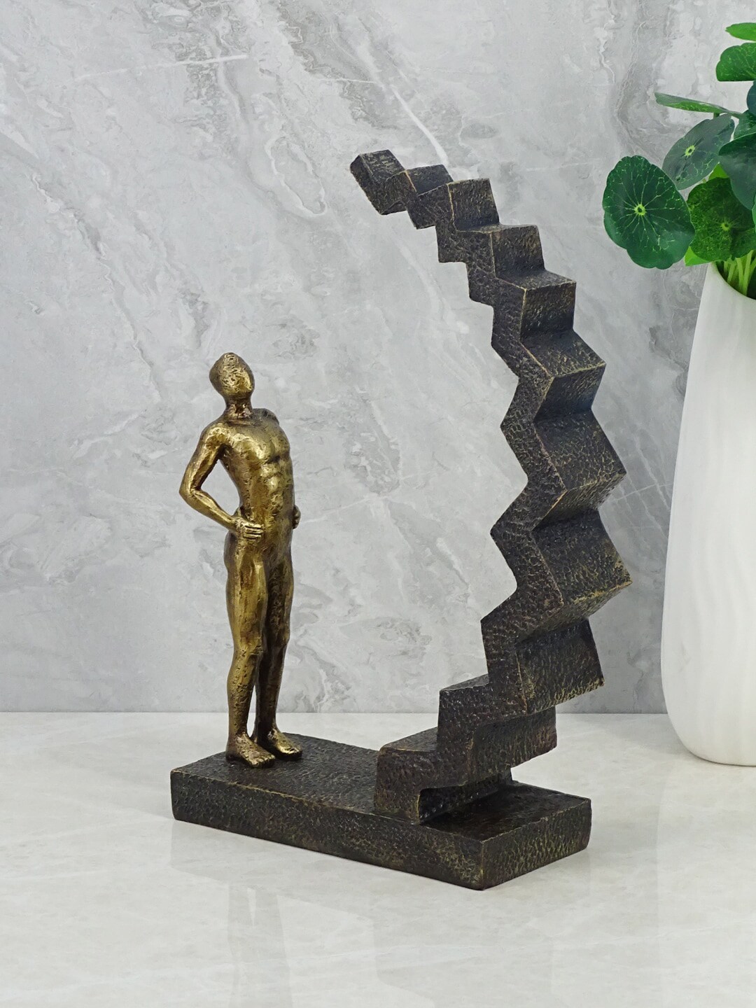 HomeTown  Brown & Gold Man On Staircase Showpieces Price in India