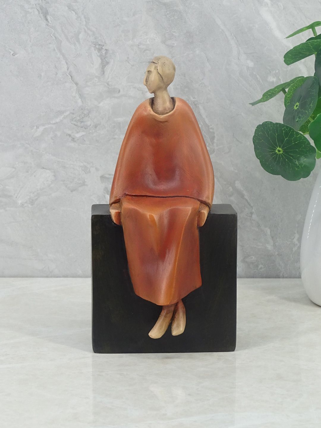 HomeTown  Brown & Black Solid Polyresin Figurine Showpieces Price in India