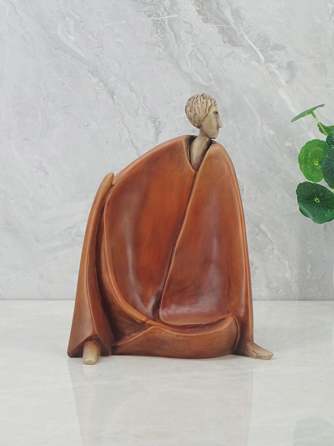 HomeTown Brown Alpine Polyresin Man Sitting Figurine Showpiece Price in India