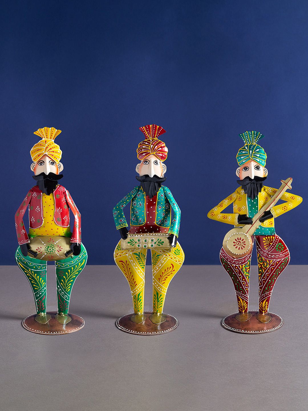 Golden Peacock Set Of 3 Yellow & Green Textured Sardar Musicians Showpieces Price in India