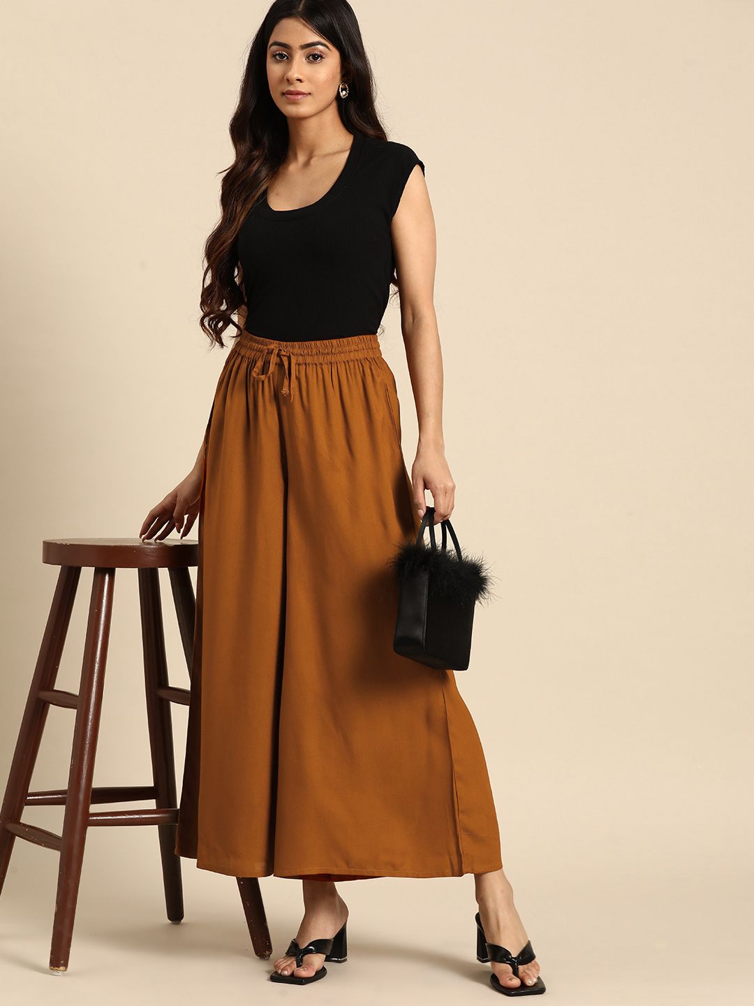 all about you Women Solid Cropped Flared Trousers Price in India