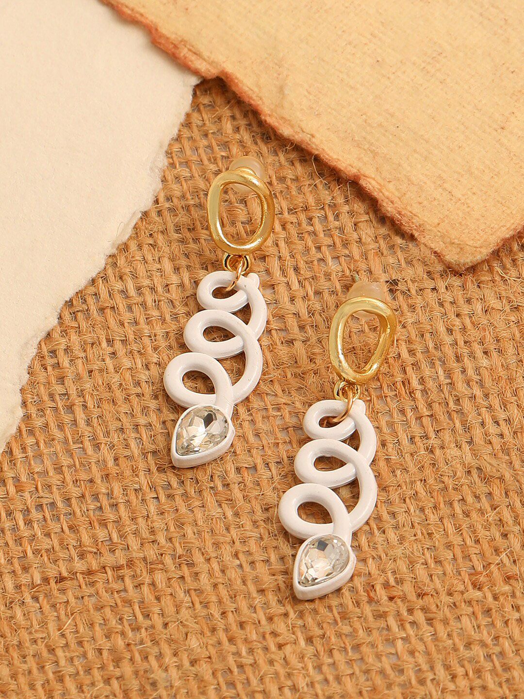 SOHI White Contemporary Drop Earrings