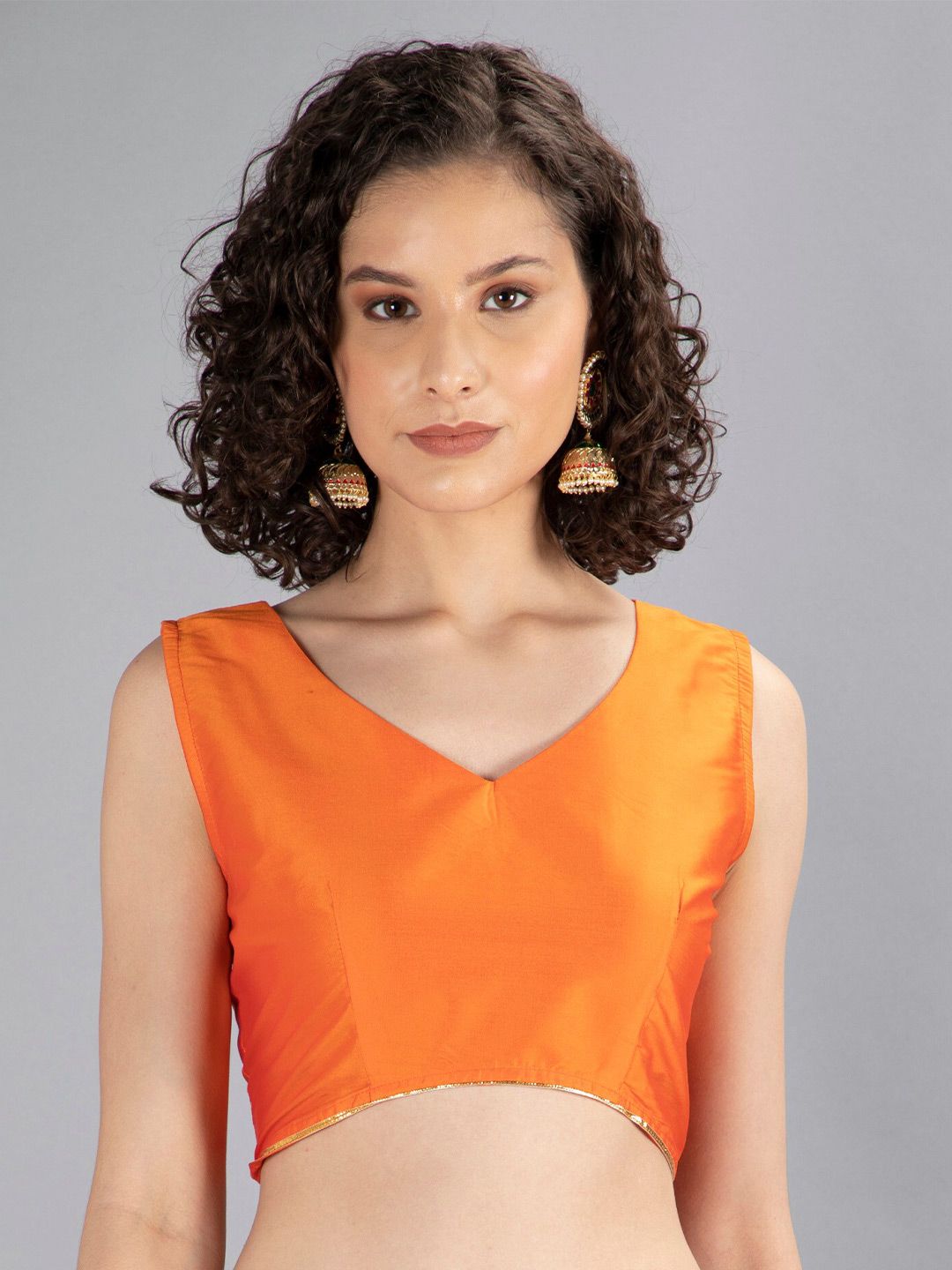 NEUDIS Orange Solid Sheen Crop Top Price in India