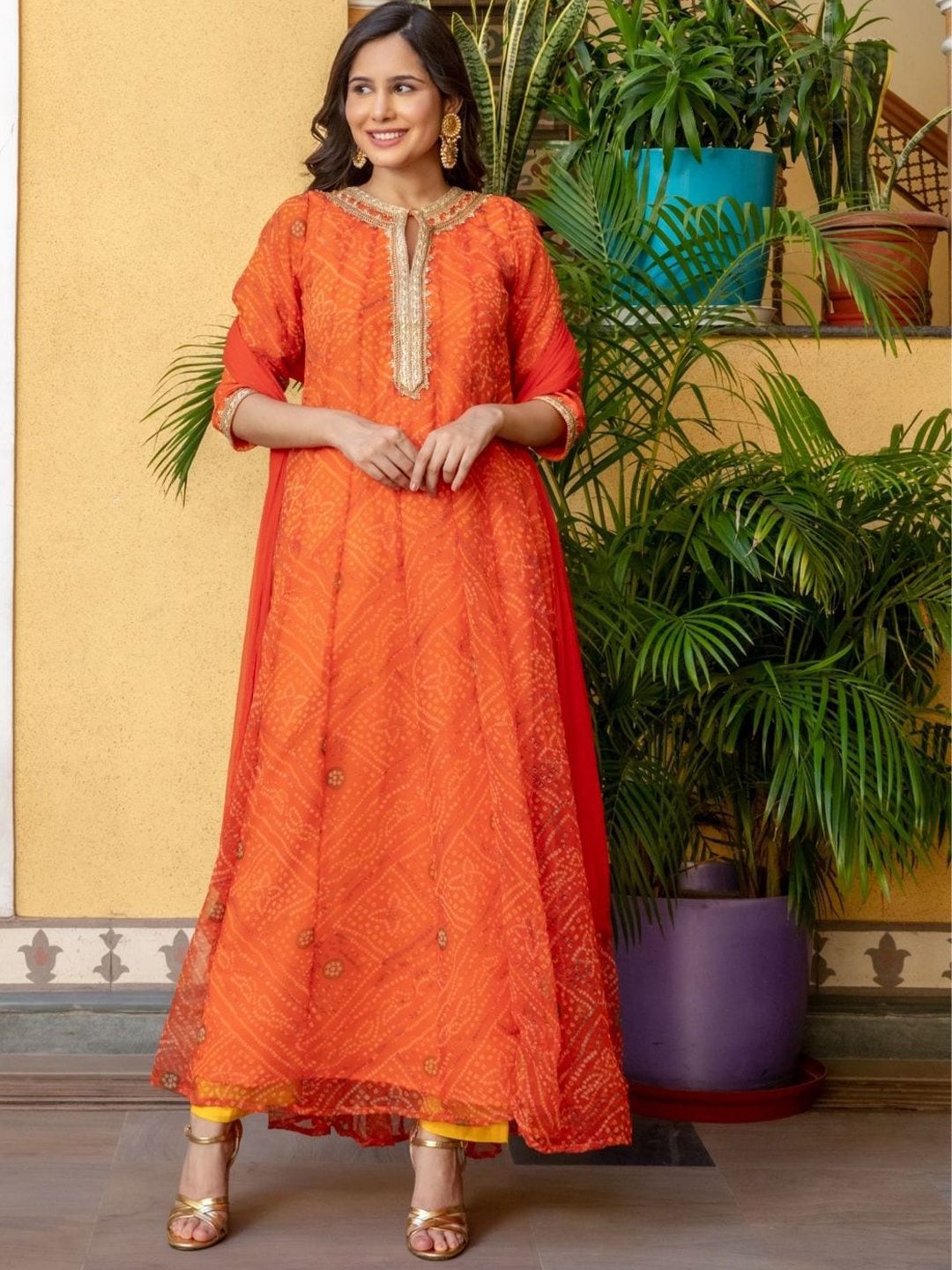 HOUSE OF JAMOTI Women Orange Bandhani Printed Gotta Patti Kurta with Trousers & With Dupatta Price in India