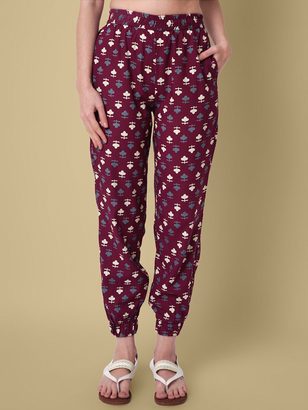 DAEVISH Women Maroon Floral Printed Smart Loose Fit Easy Wash Joggers Trousers Price in India