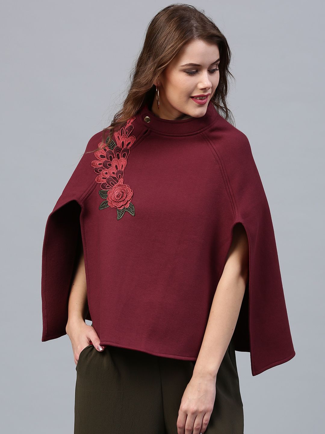 SASSAFRAS Maroon Solid Poncho Shrug with Floral Applique Price in India