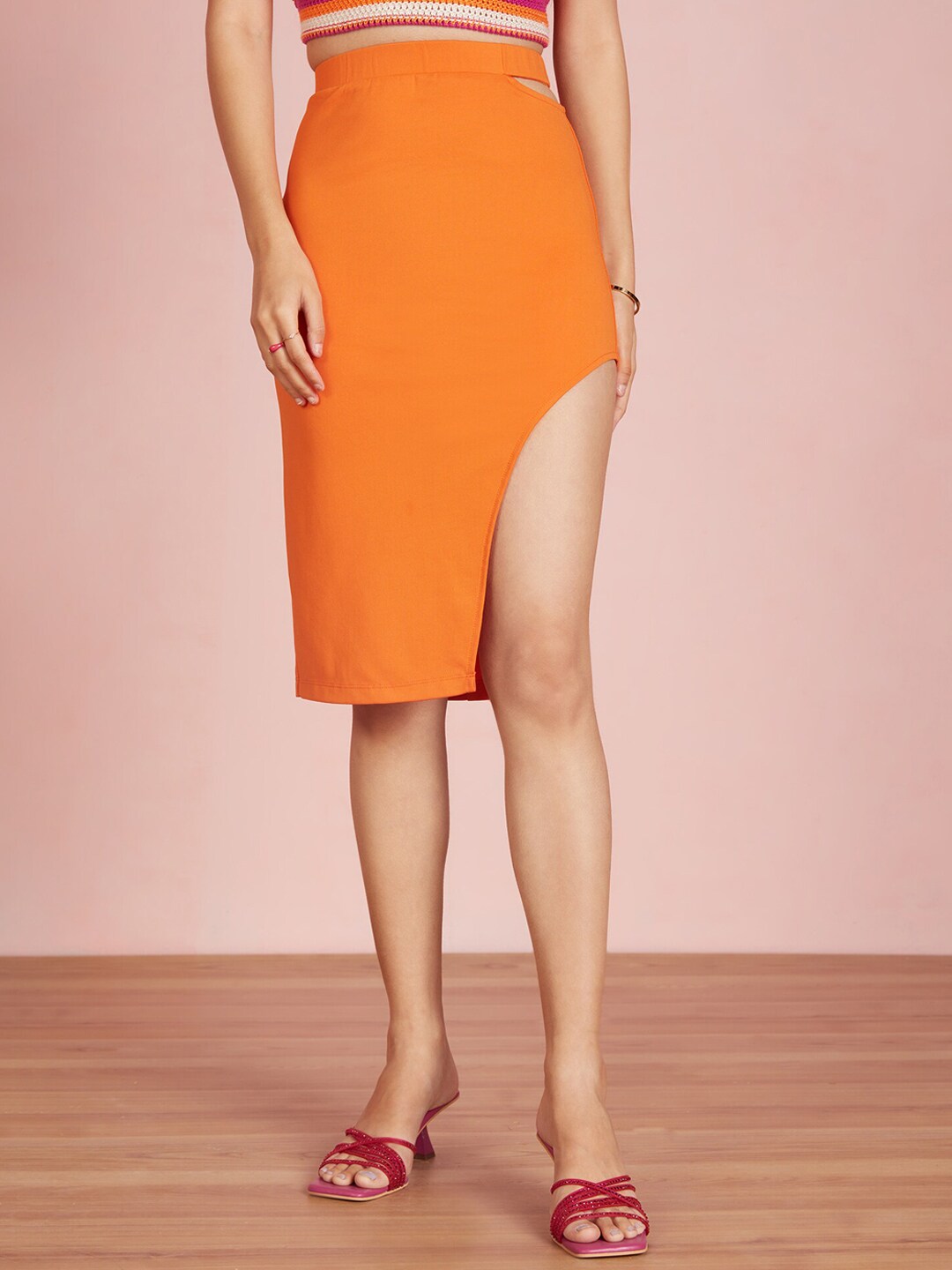 20Dresses XXD Awestruck Orange Solid Side Cut Out Bodycon Skirt Price in India