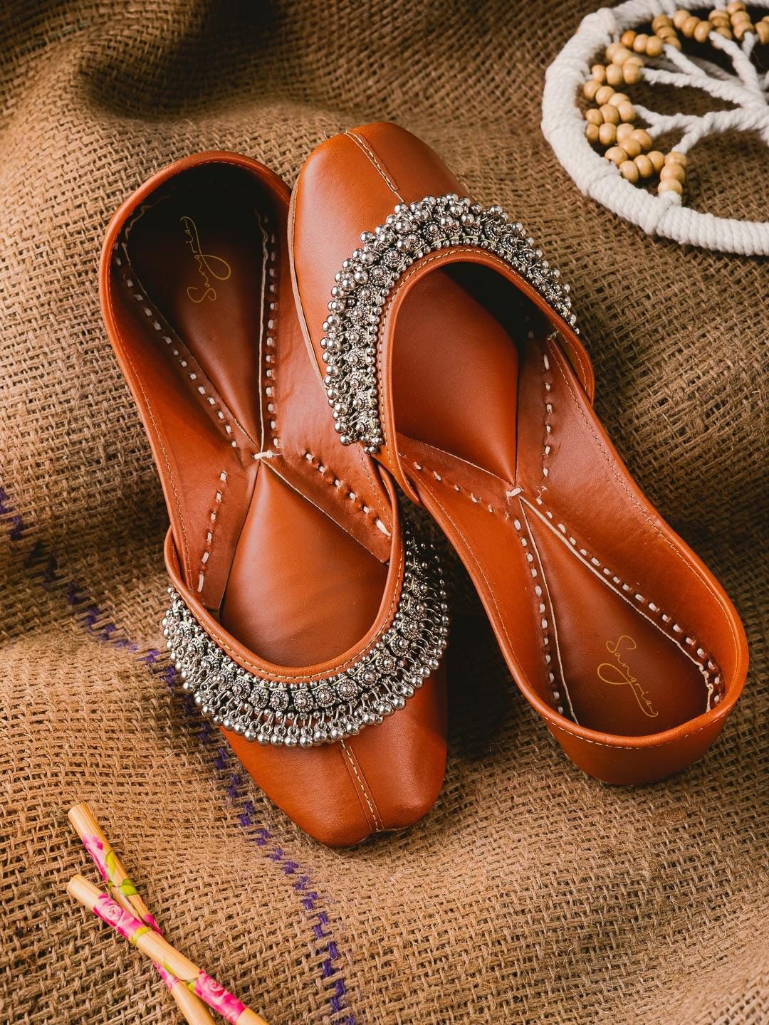 Sangria Tan Brown And Silver-Toned Embellished Leather Mojaris Price in India