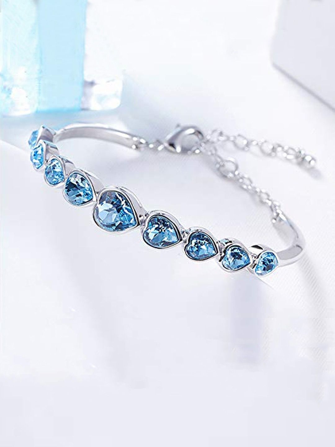 Yellow Chimes Crystals from Swarovski Collection Blue & Silver-Toned Metal Rhodium-Plated Charm Bracelet Price in India