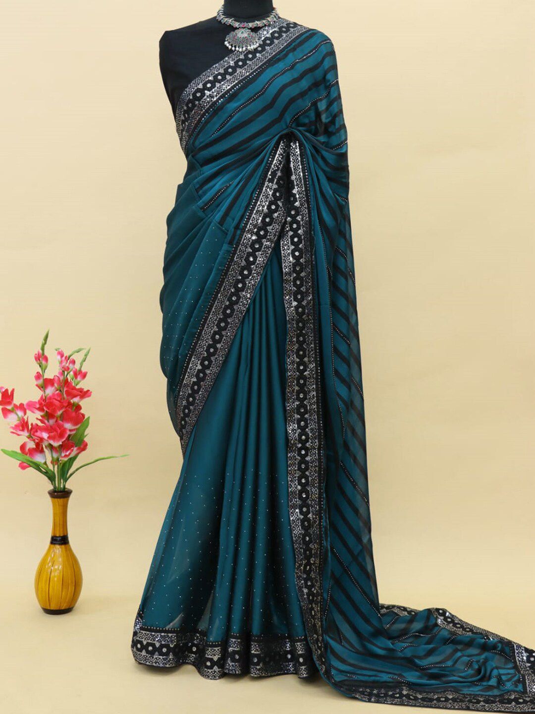 Anouk Teal & Black Striped Embellished Sequinned Pure Georgette Saree Price in India