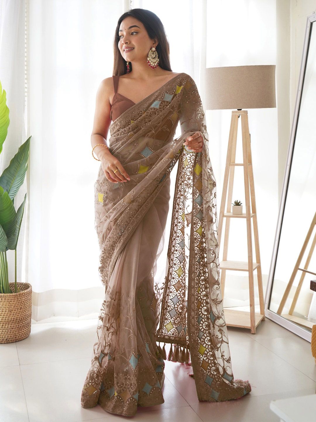 Saree mall Brown & Yellow Ethnic Motifs Embroidered Net Saree Price in India