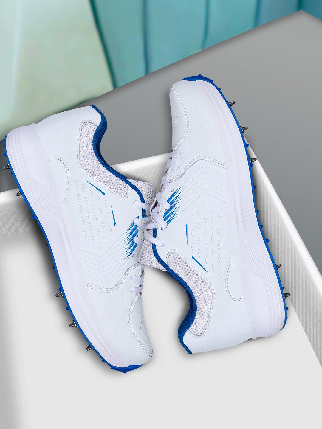 Aivin Men White And Blue Super King Cricket Shoes