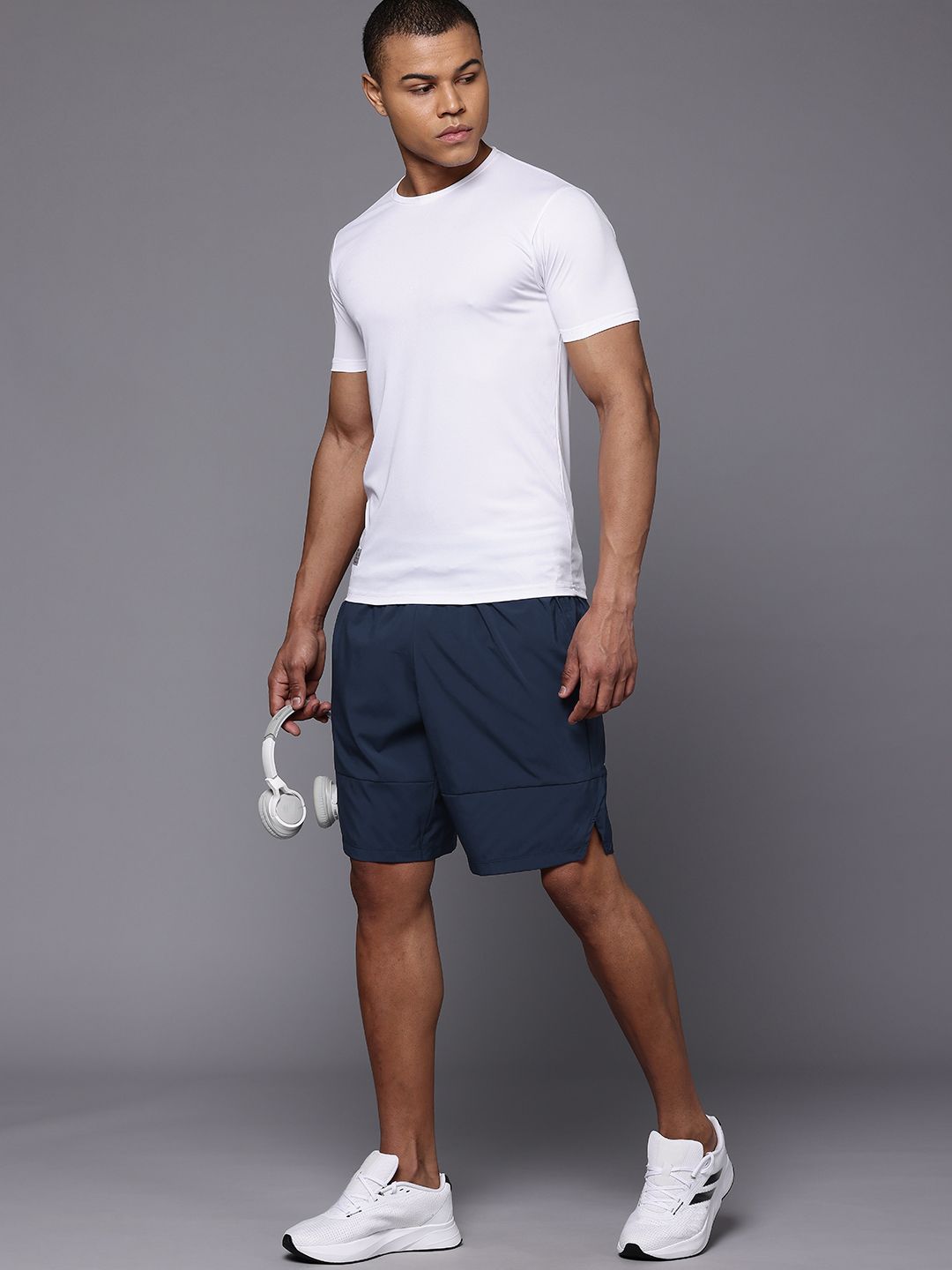 Buy New Balance Men Fast Drying Tenacity 9 Inch Woven Sports
