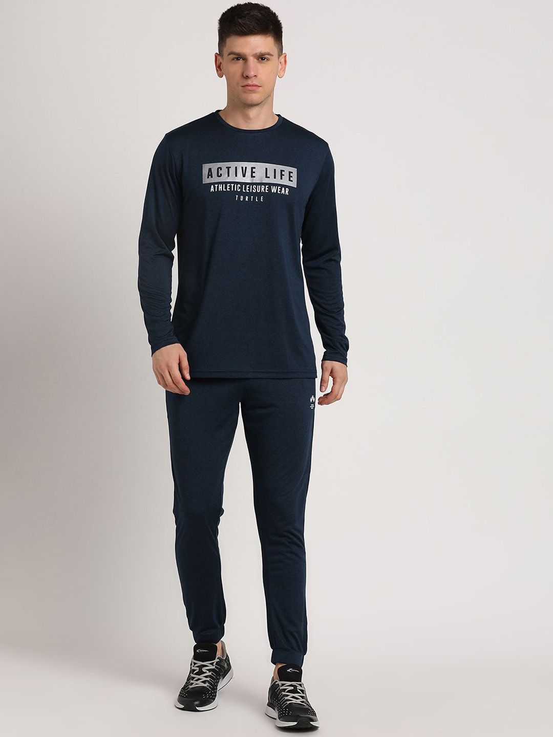 http://assets.myntassets.com/assets/images/29674470/2024/5/21/4b24fb9d-756d-40fb-bc4c-5b2a4ba4f38f1716291632723TurtleMenCottonNavyBluePlainFullSleeveActiveTrackSuit1.jpg