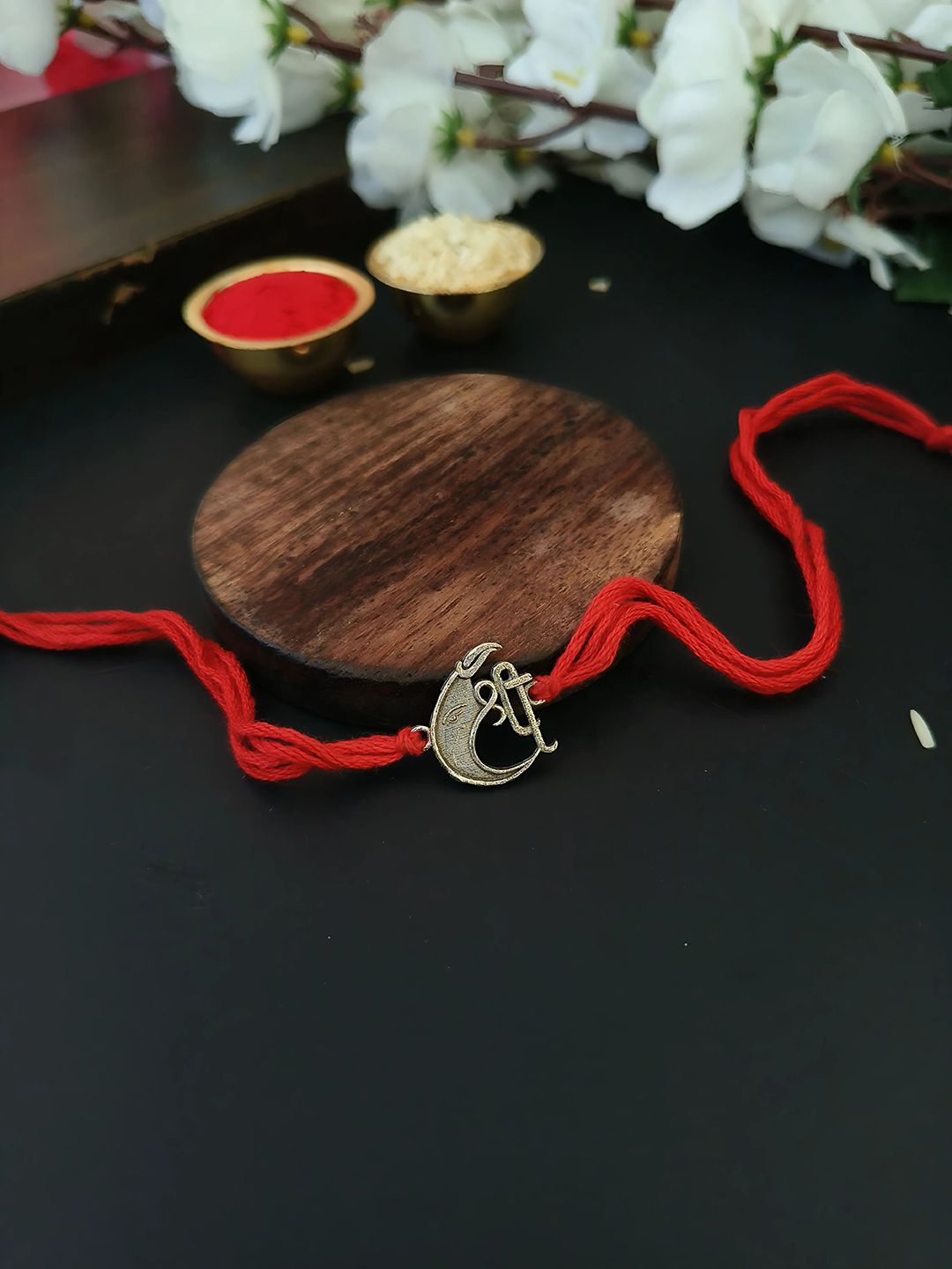 Sangria Red Shree Ganesha Thread Rakhi