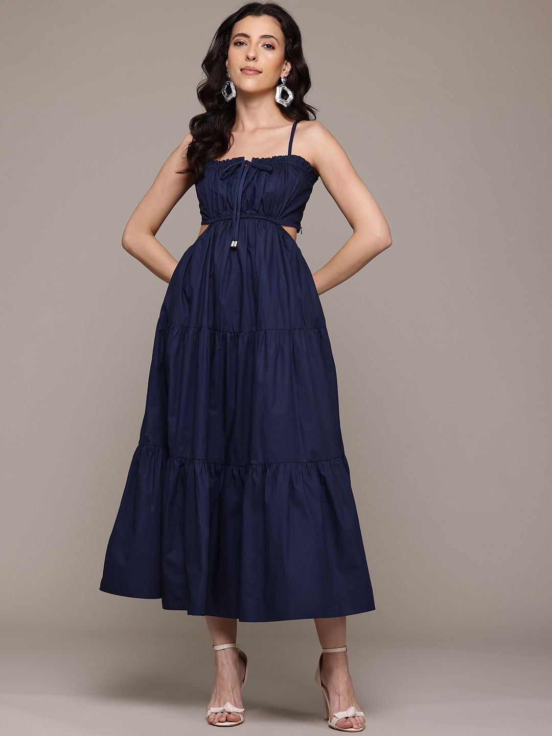 ritu kumar navy blue dress Classic Ritu Kumar motifs adorn the neckline and cuffs on this indigo dress. Shaped like a kaftan, this expanse of chinon flows freely in the breeze. Jewellery by @apalabysumitofficial. #RituKumar #FestiveWinter2025