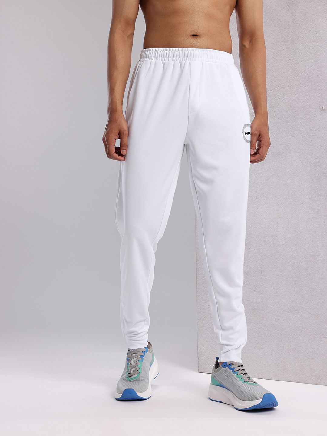 Buy HRX by Hrithik Roshan Men Zipped Hem Rapid-Dry Running Track