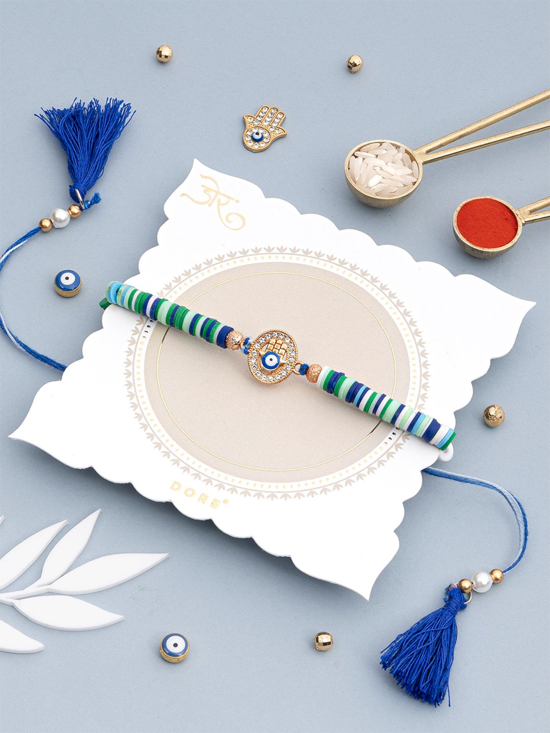 Dore Hamsa Evil Eye Rakhi with Blue & Green Clay Disc Beads