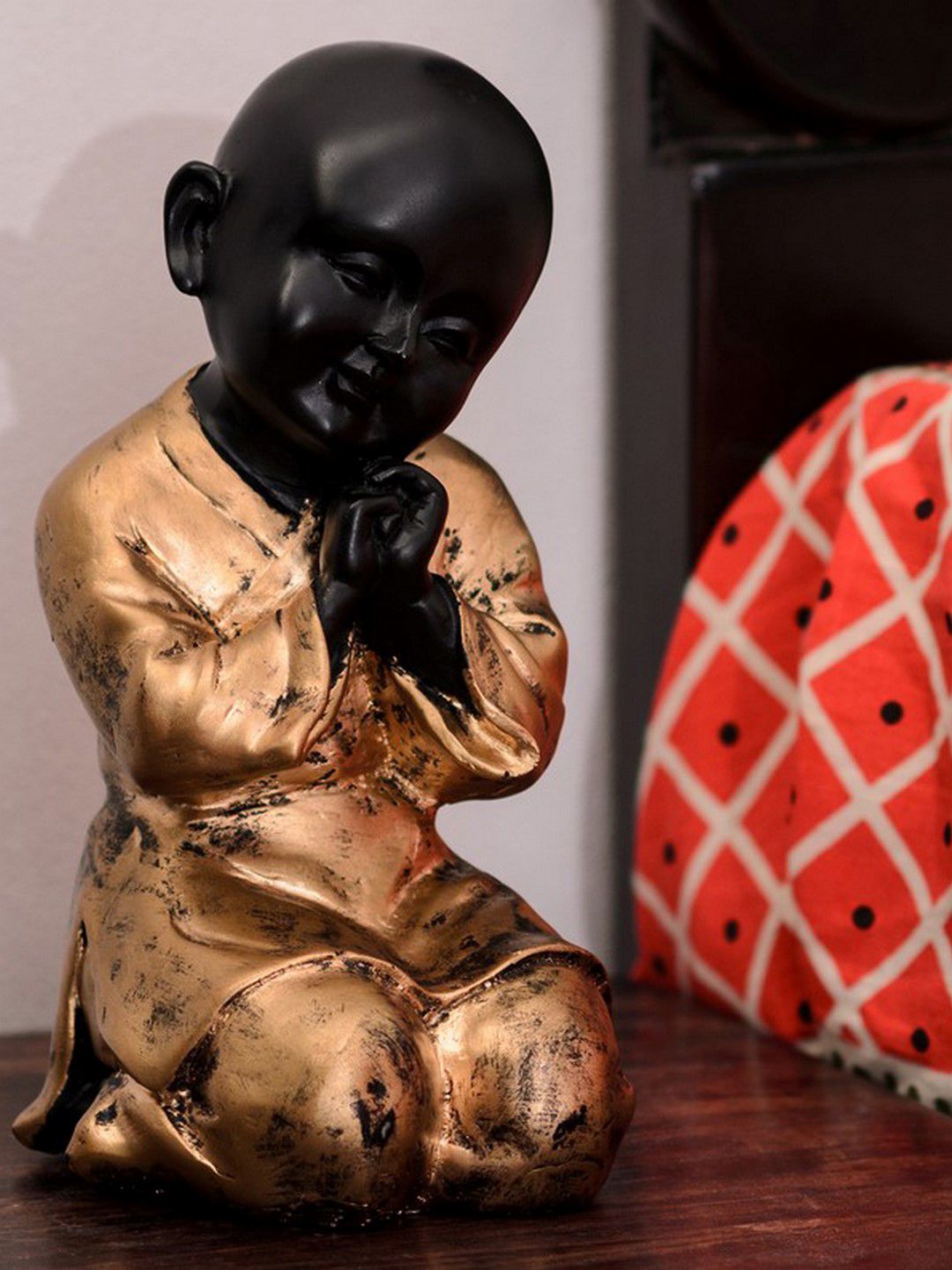 eCraftIndia Gold-Toned & Black Polyresin Handcrafted Golden Child Monk Figurine Price in India