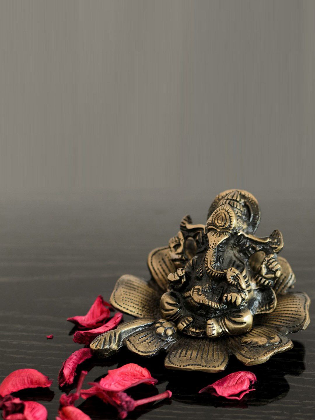 eCraftIndia Metal Lord Ganesha on Flower Showpiece Price in India