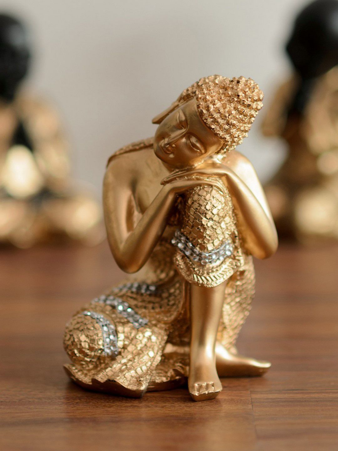 eCraftIndia Gold-Toned Handcrafted Buddha on Knee Polyresin Showpiece Price in India