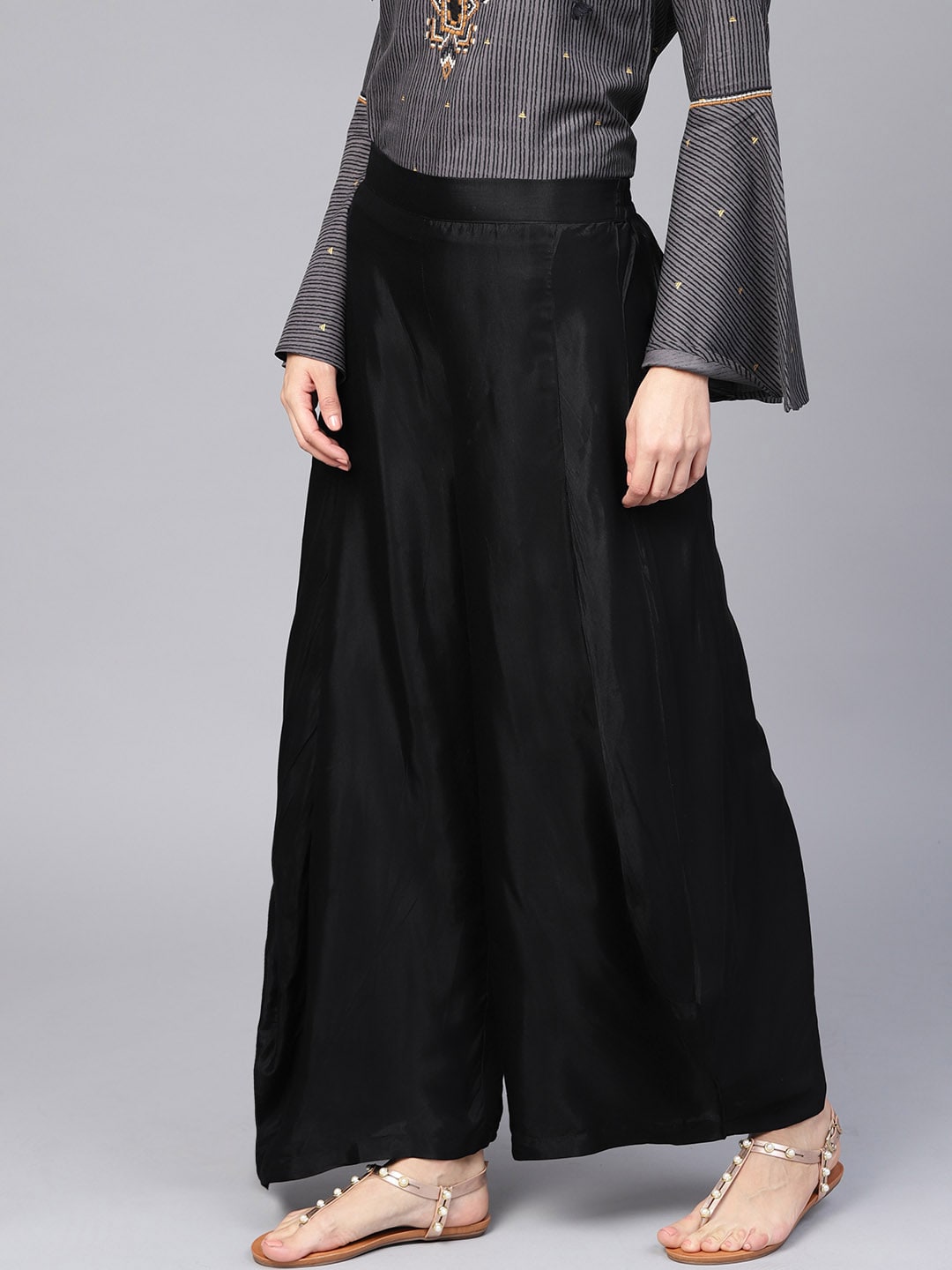 W Women Black Flared Solid Palazzos Price in India