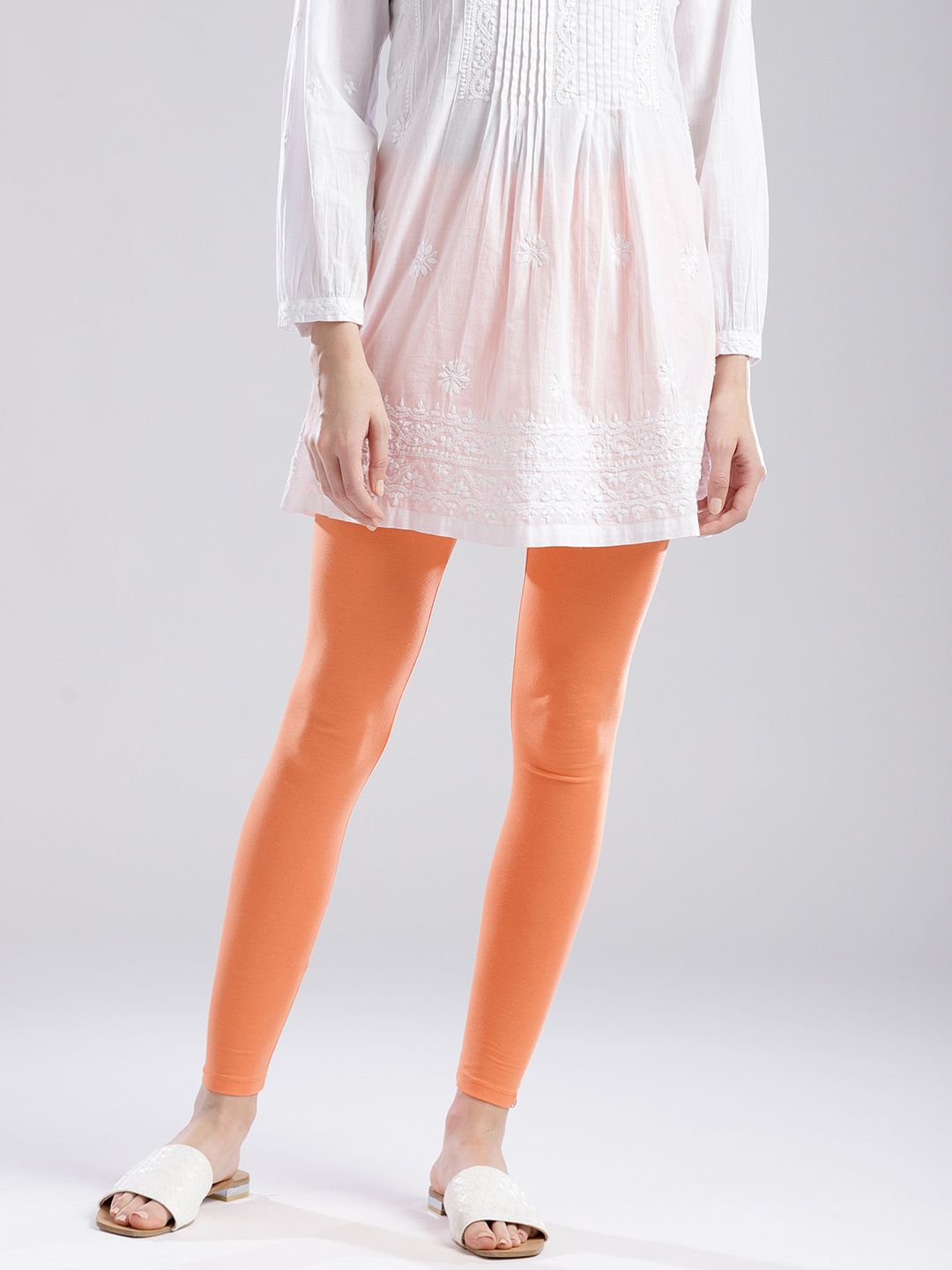 W Women Coral Orange Solid Ankle-Length Leggings Price in India