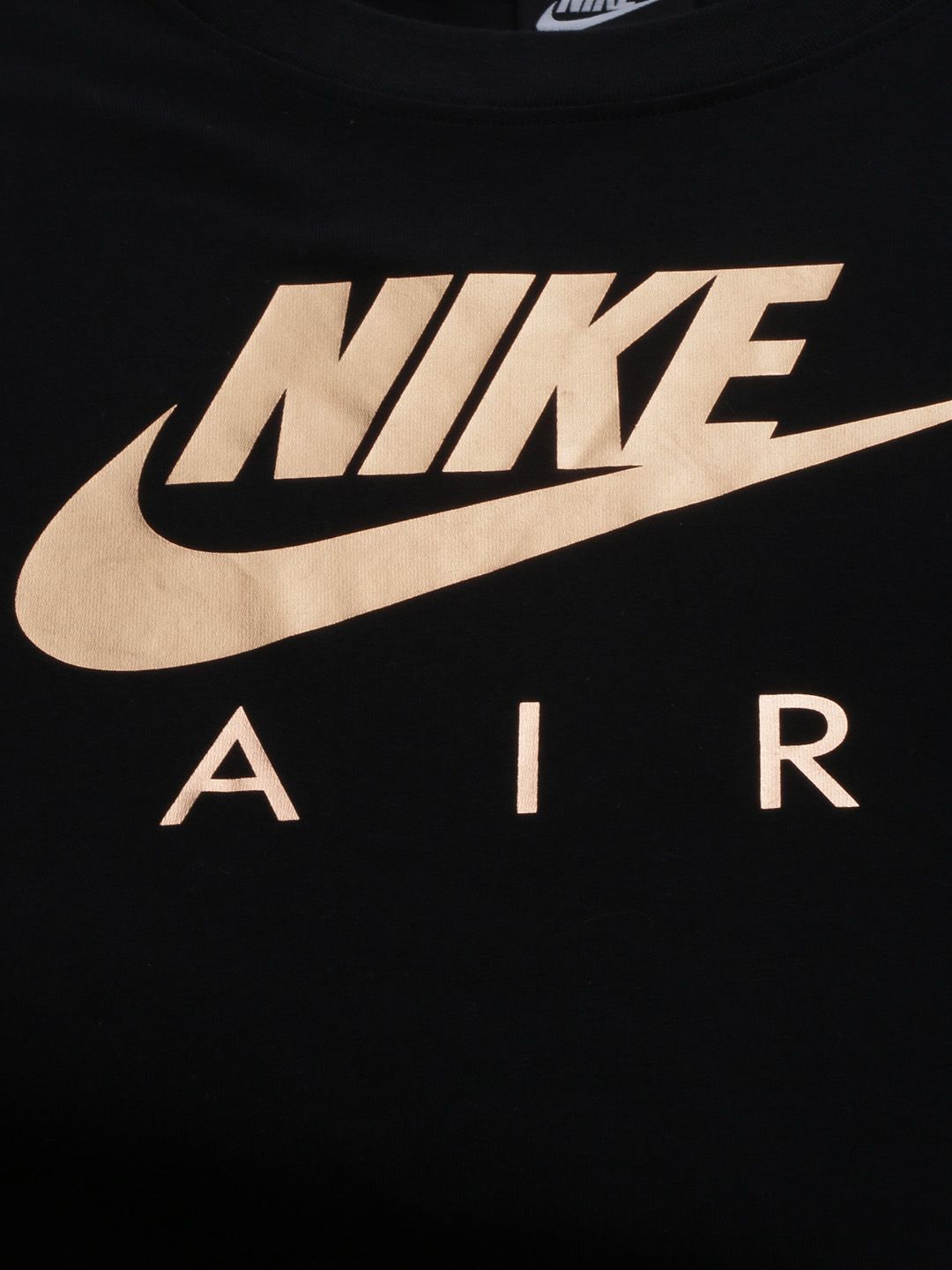 women black and gold nike shirt