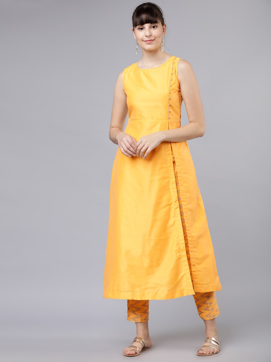 Vishudh Women Yellow Solid Kurta with Trousers Price in India