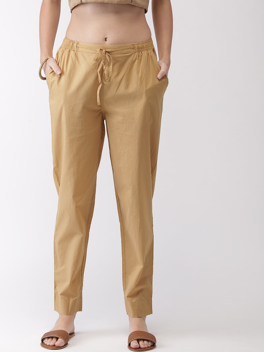 Go Colors Women Beige Regular Fit Solid Cotton Trousers Price in India