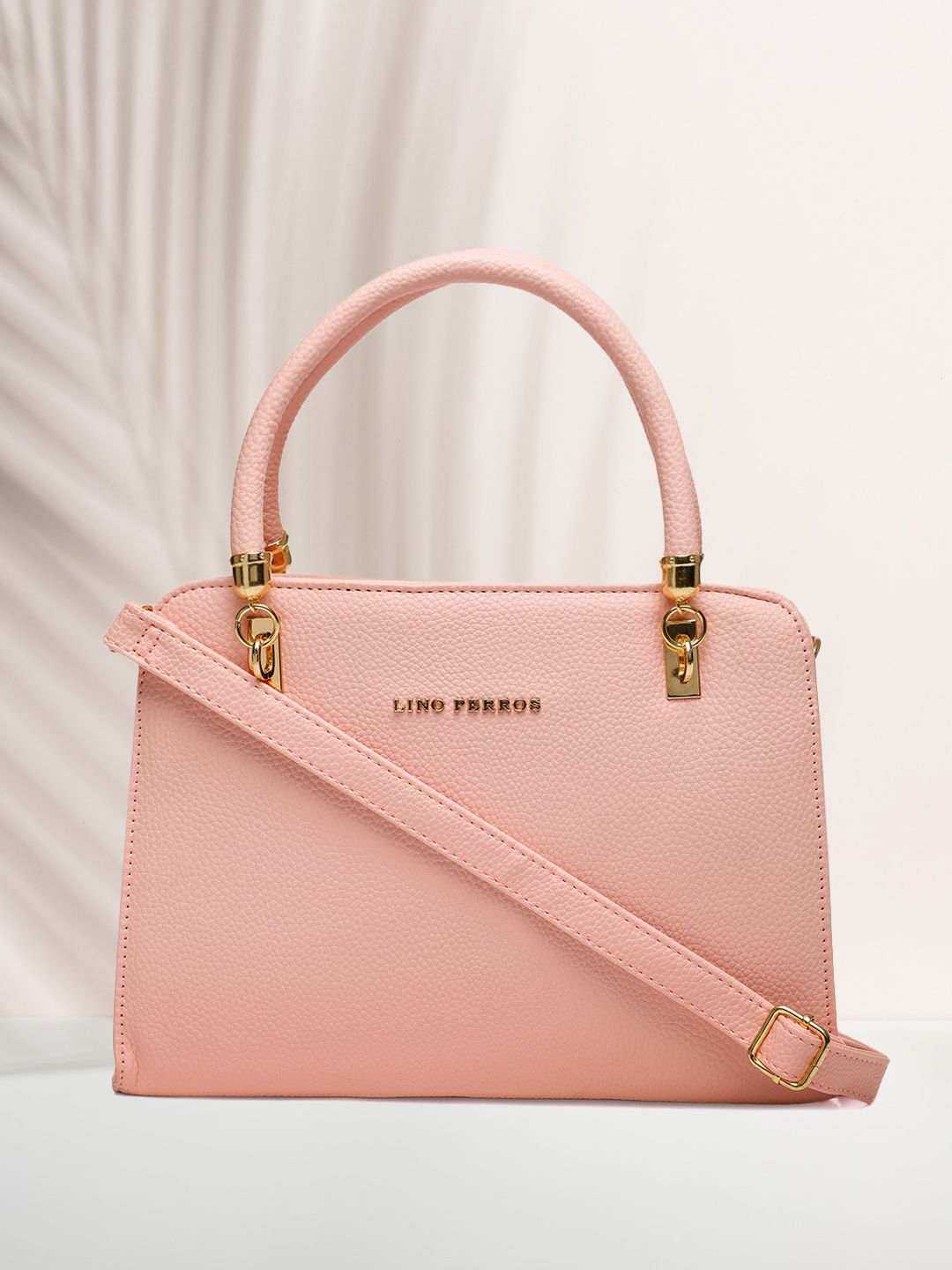 Lino Perros Pink Solid Handheld Bag Price in India
