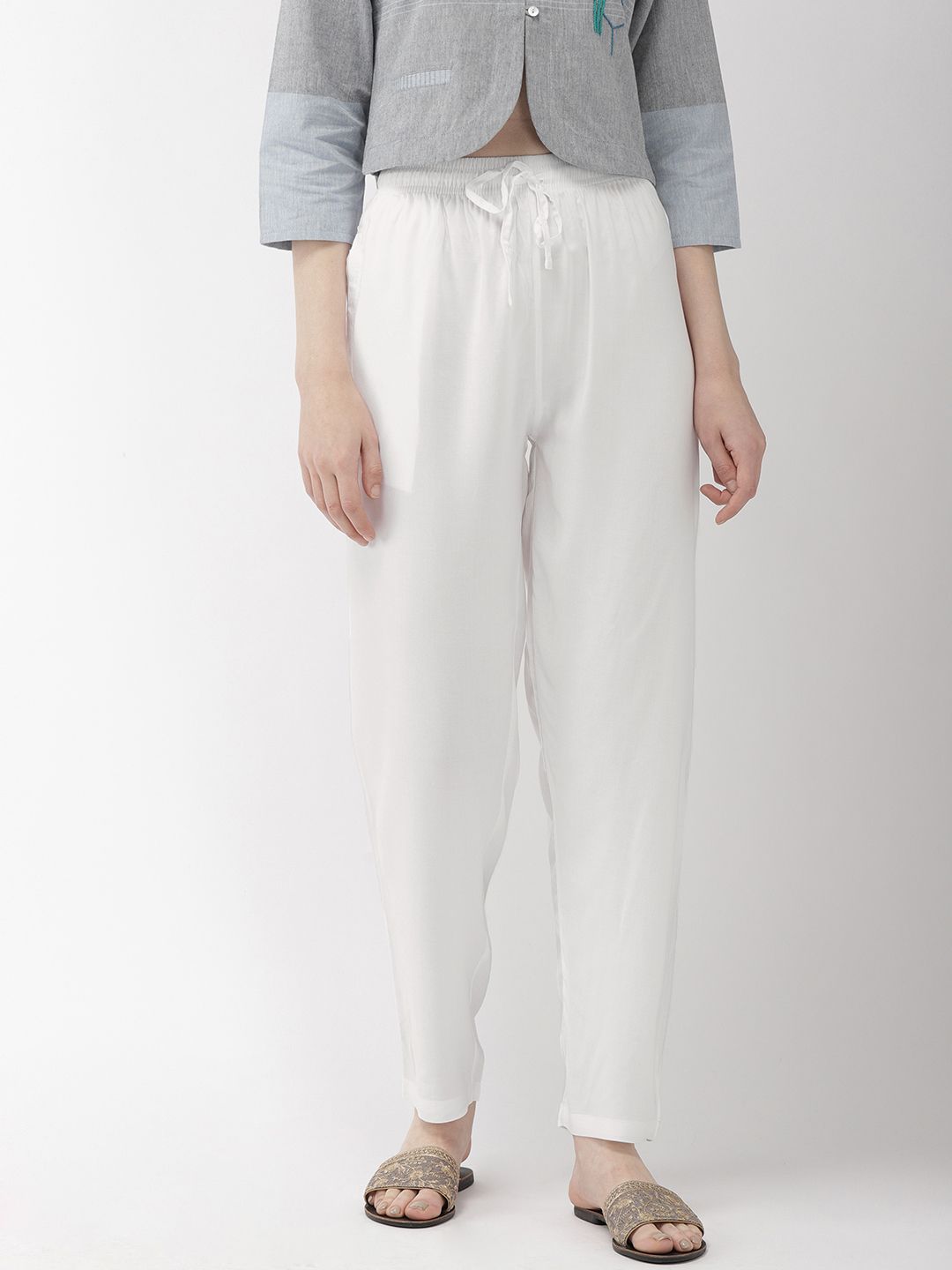 Go Colors White Solid Relaxed Fit Casual Trousers Price in India