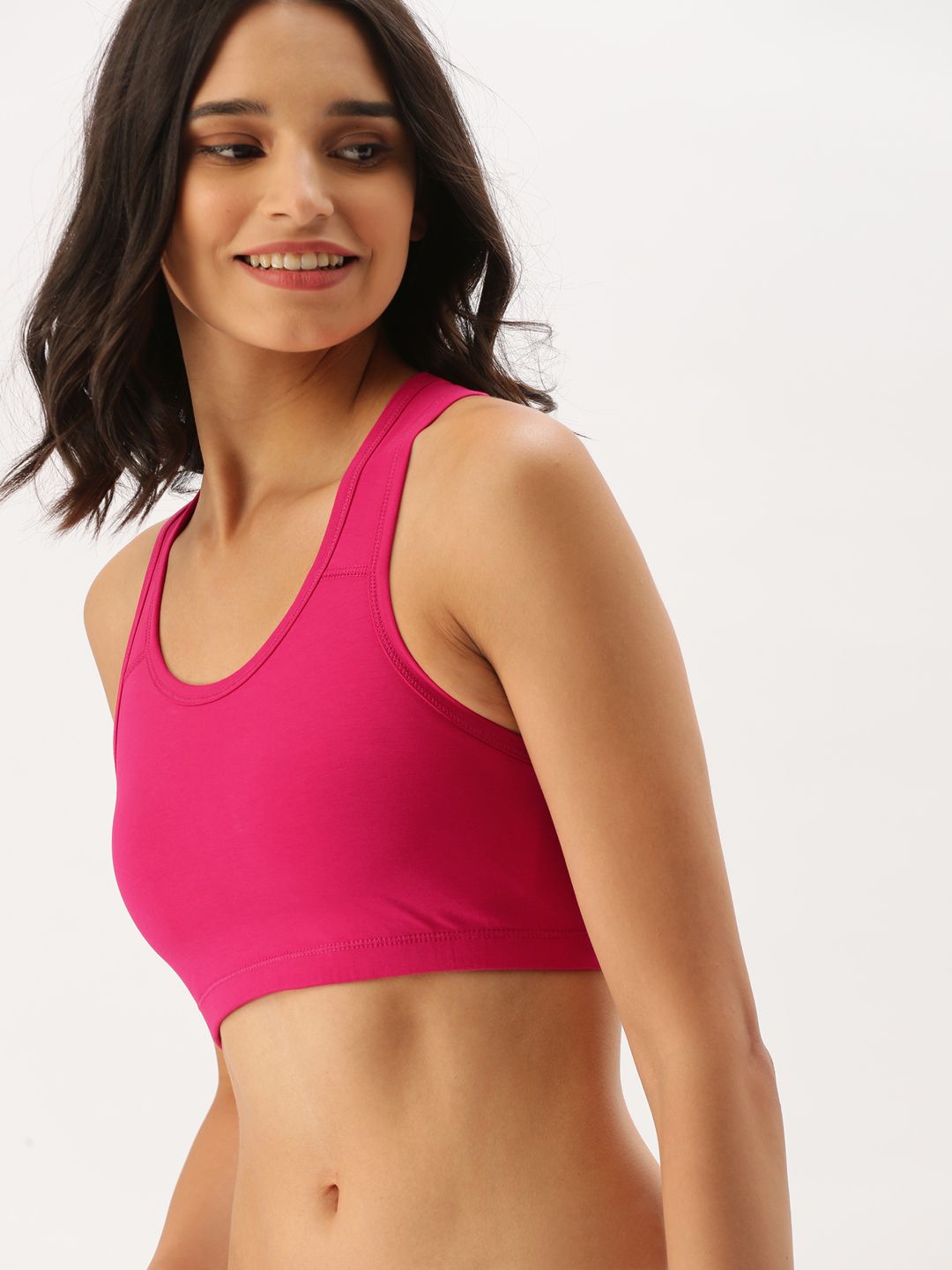 DressBerry Fuchsia Solid Non-Wired Non Padded Sports Bra Price in India