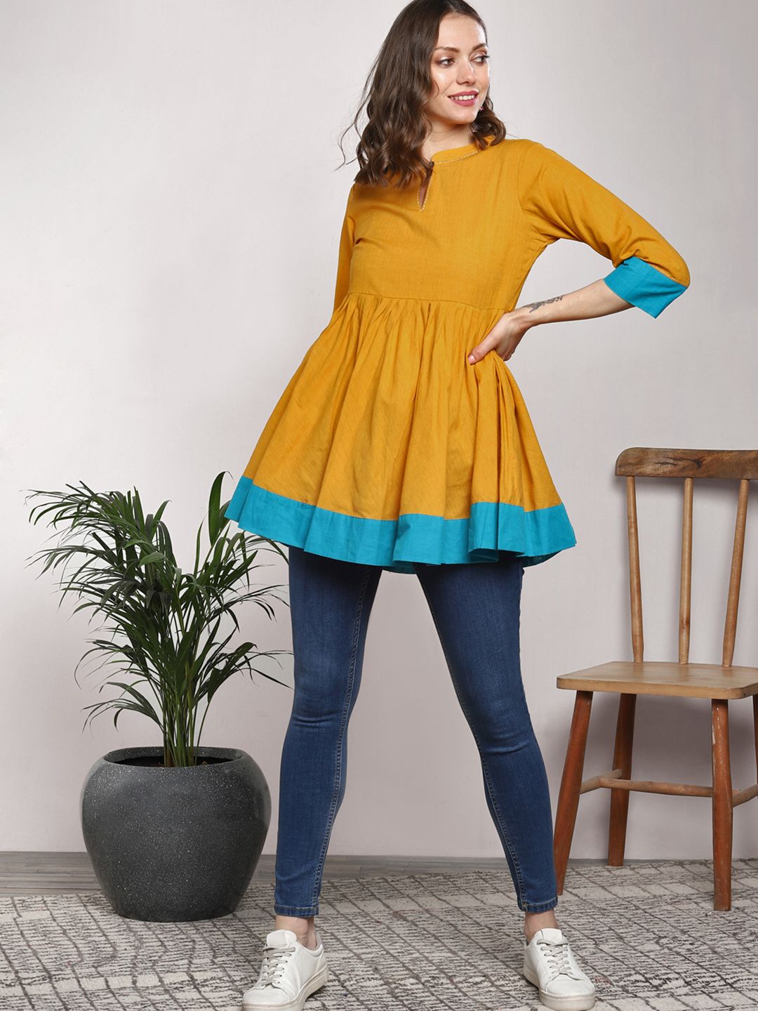 Sangria Women Mustard Yellow Solid Pure Cotton Pleated A-Line Pure Cotton Kurti Price in India