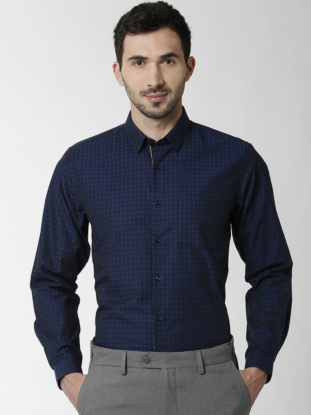 grey pant with navy blue shirt