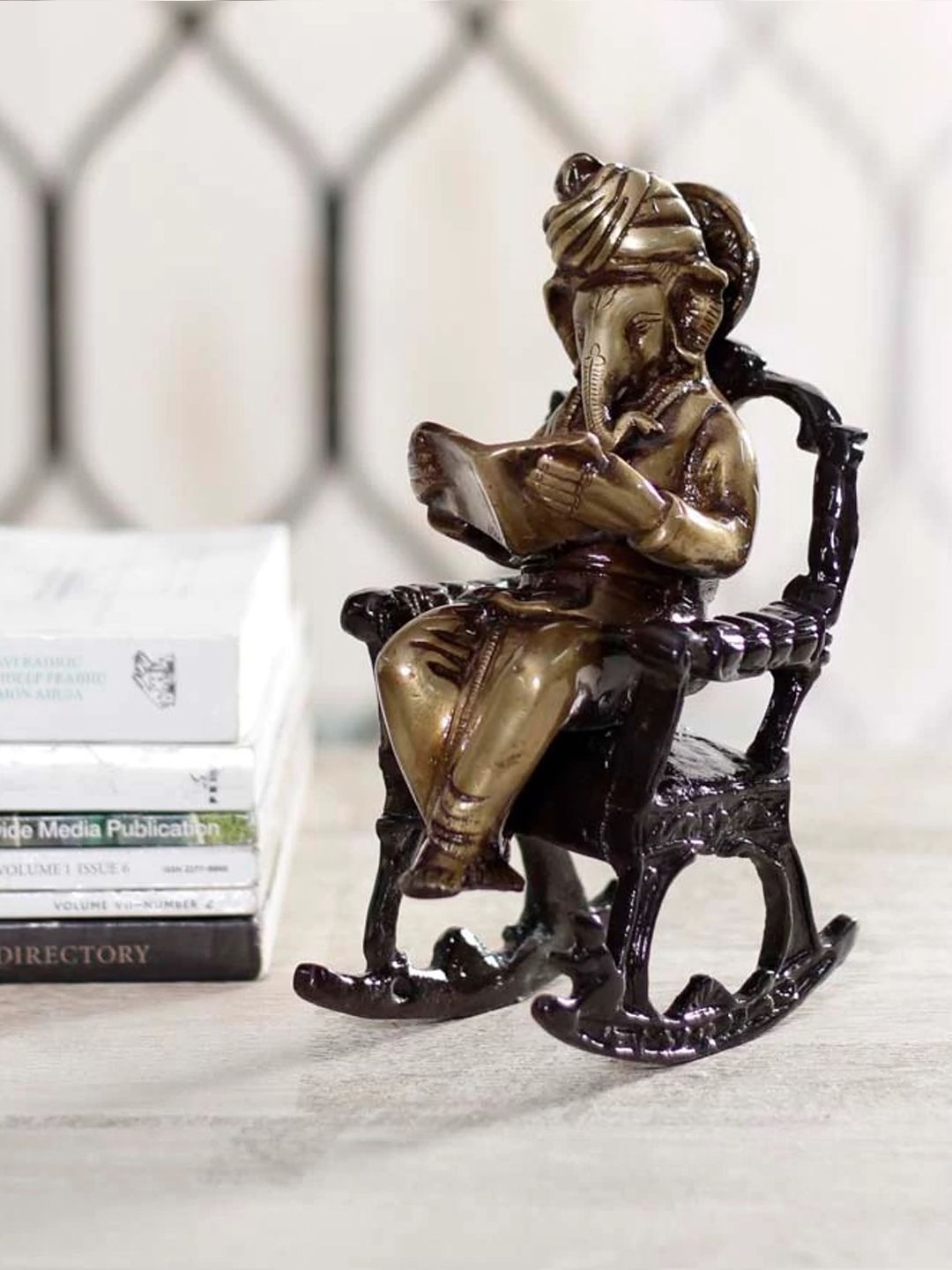 eCraftIndia Brown & Black Lord Ganesha on Rocking Chair Showpiece Price in India