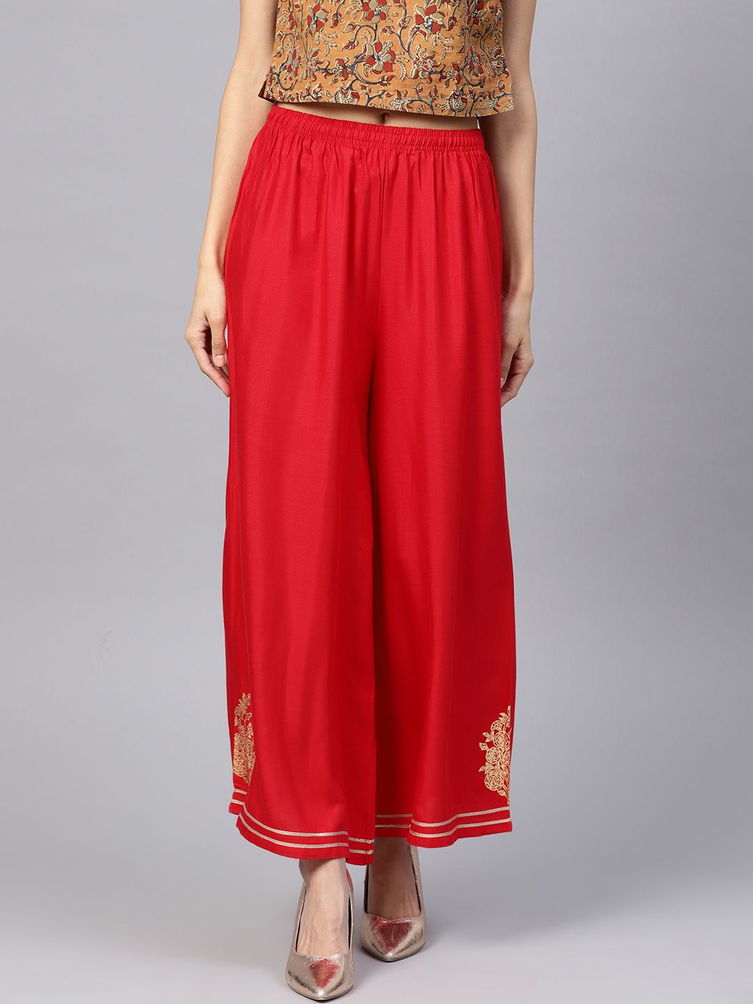 PINKSKY Women Red Flared Solid Palazzos Price in India