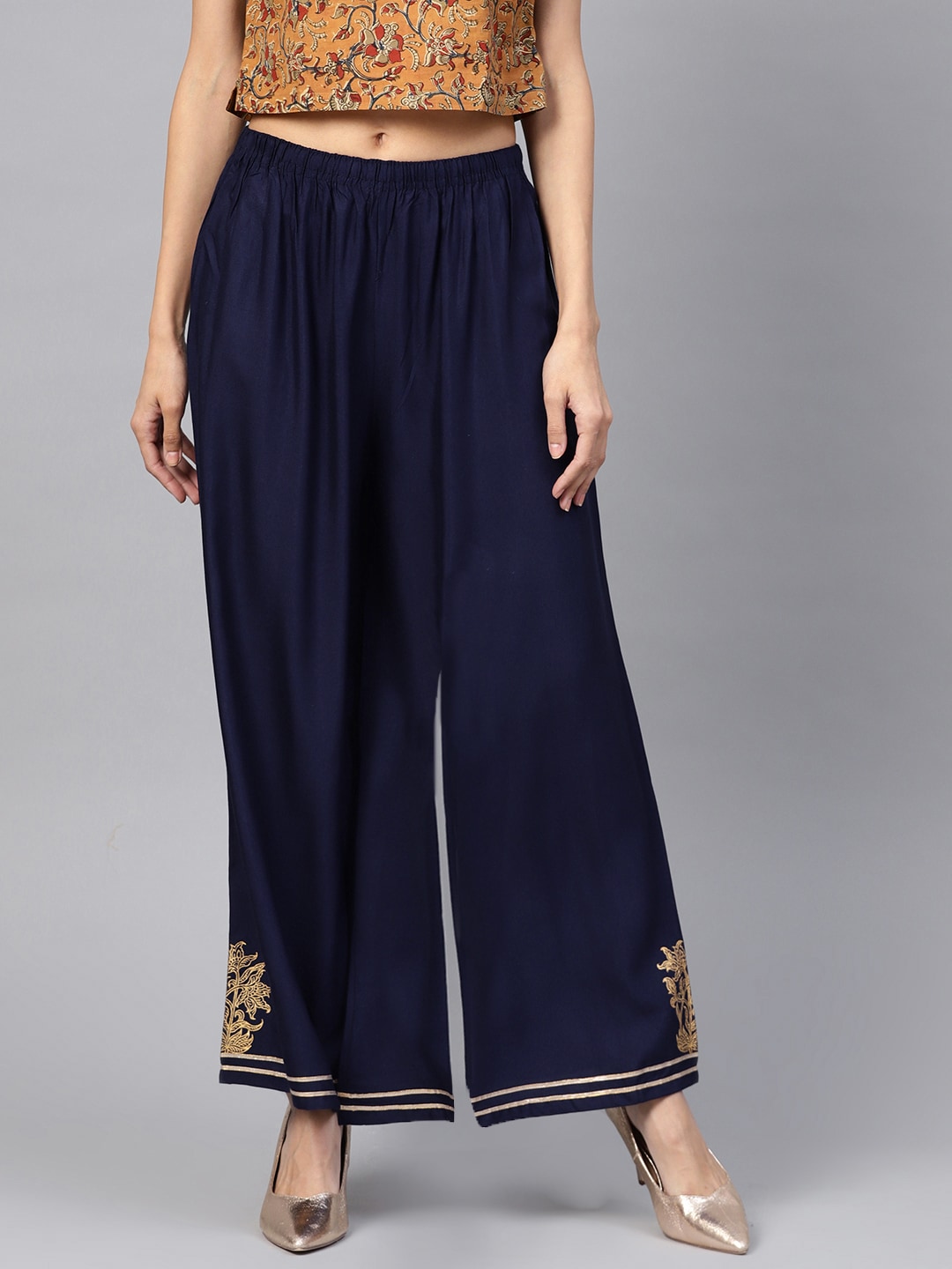 PINKSKY Women Navy Blue Solid Flared Palazzos Price in India